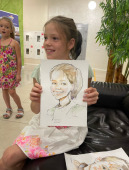  Аня улыбается с шаржем, Михаил Шабалин, шаржист