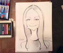 Шарж черным карандашем Юлии от шаржиста Мишеля
